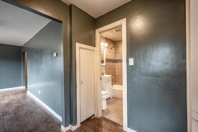 corridor featuring tile patterned floors