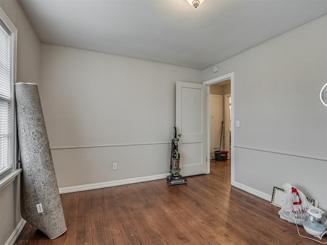 unfurnished room with hardwood / wood-style floors