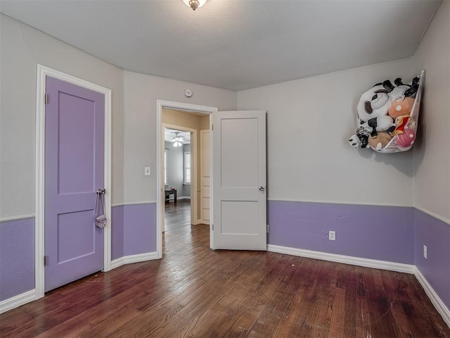 spare room with dark hardwood / wood-style flooring