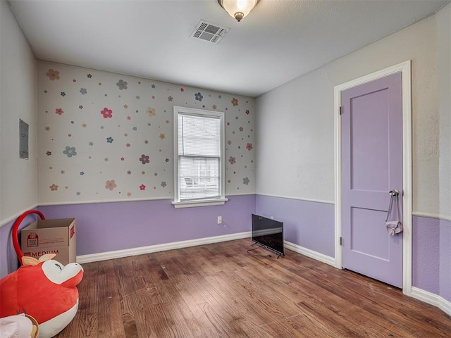 unfurnished bedroom featuring hardwood / wood-style floors