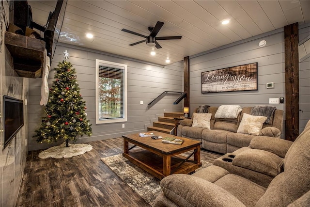 living room with wooden walls, hardwood / wood-style floors, ceiling fan, and wood ceiling