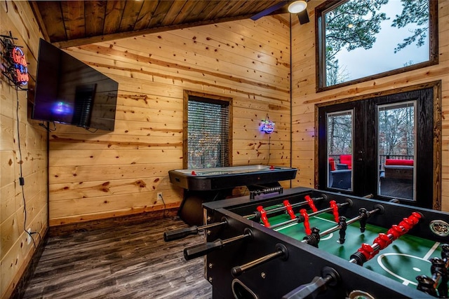 rec room with wood walls, wood-type flooring, lofted ceiling, and wooden ceiling