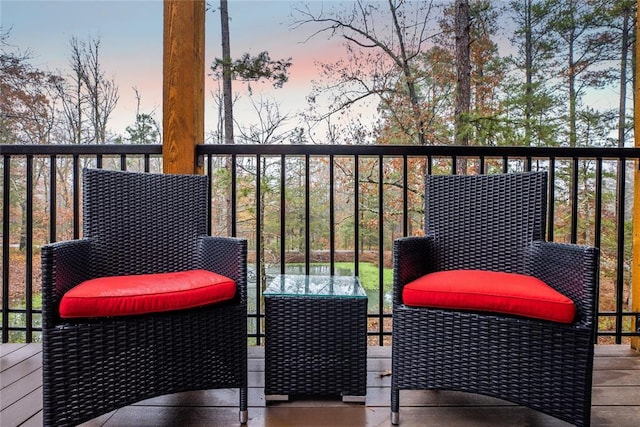 view of balcony at dusk