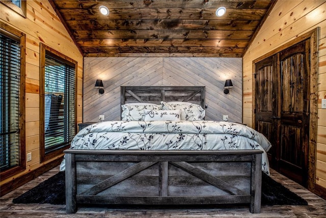 bedroom featuring wooden walls, wood ceiling, and vaulted ceiling