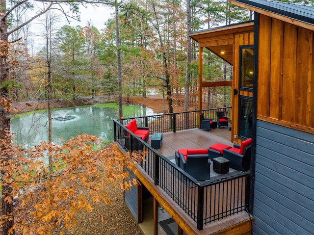 deck featuring a water view and an outdoor hangout area