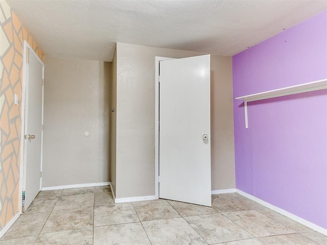 unfurnished bedroom with a closet