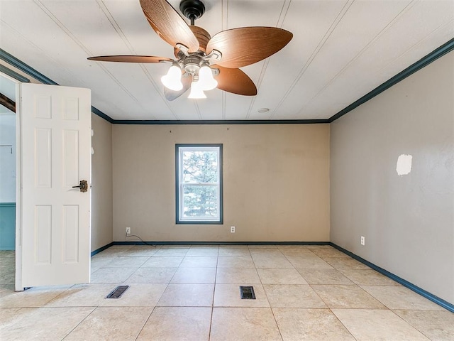 tiled empty room with ceiling fan and crown molding