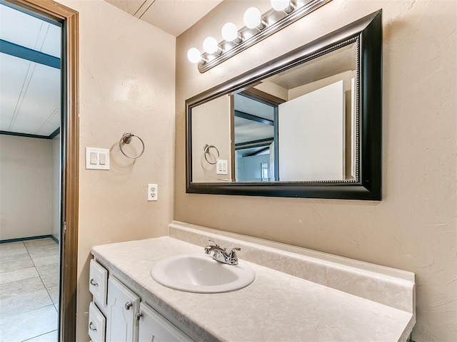 bathroom featuring tile patterned flooring and vanity