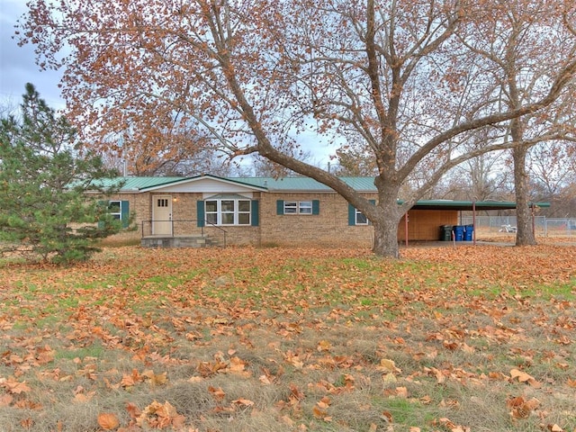 rear view of house featuring a carport