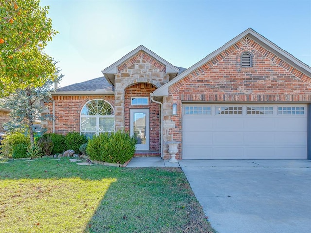 front of property with a front lawn and a garage