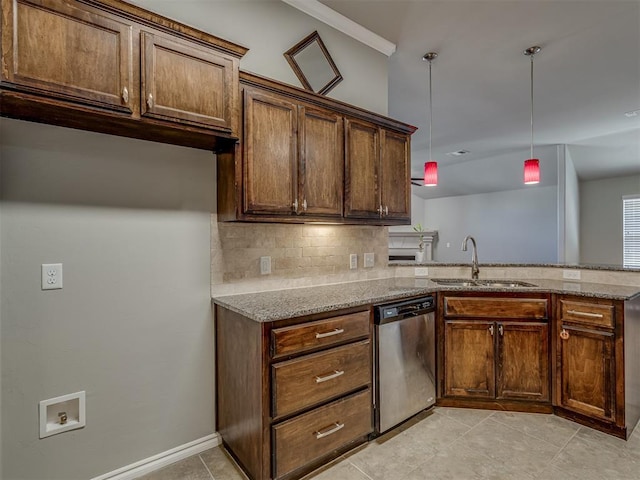 kitchen featuring kitchen peninsula, light stone countertops, sink, pendant lighting, and dishwasher