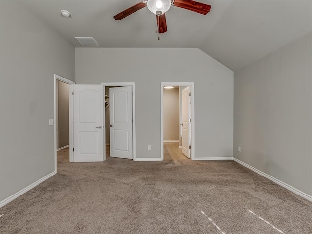 unfurnished bedroom featuring ceiling fan, light carpet, and lofted ceiling