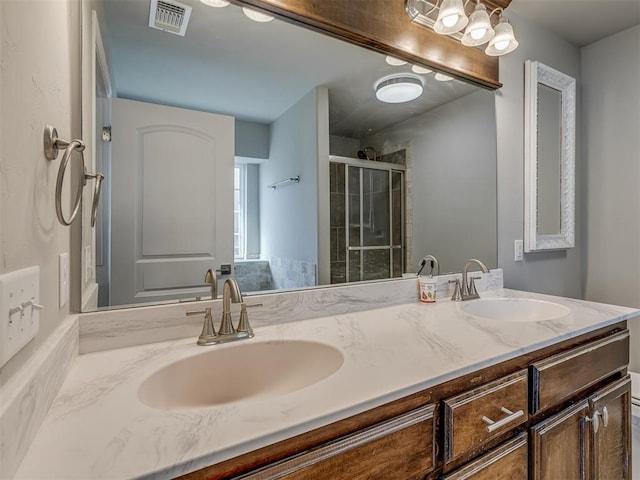 bathroom with vanity and walk in shower