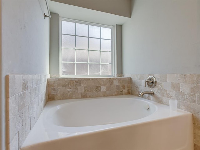 bathroom featuring a bath