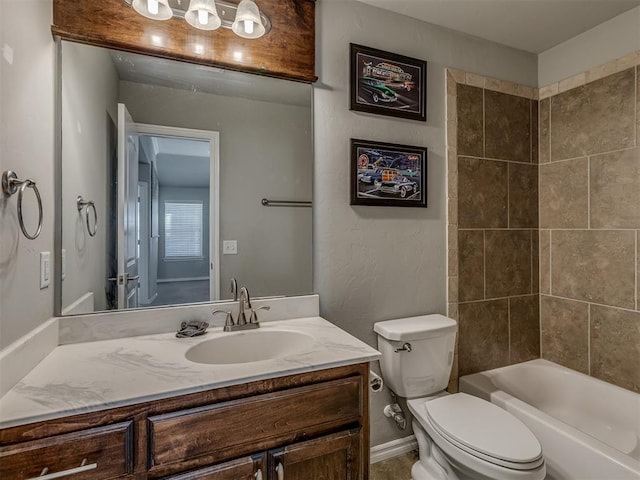 full bathroom featuring vanity, tiled shower / bath combo, and toilet