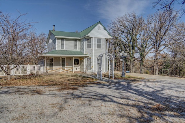 view of front of property featuring covered porch