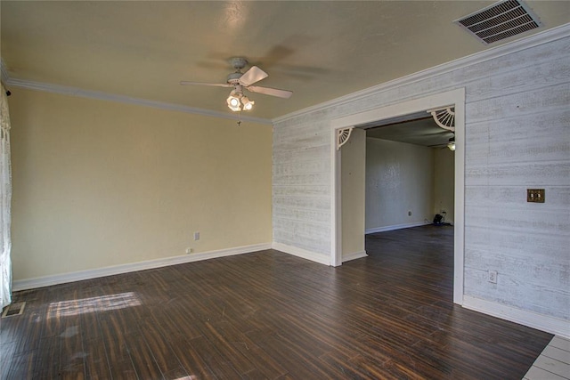 spare room with dark hardwood / wood-style floors, ceiling fan, and crown molding