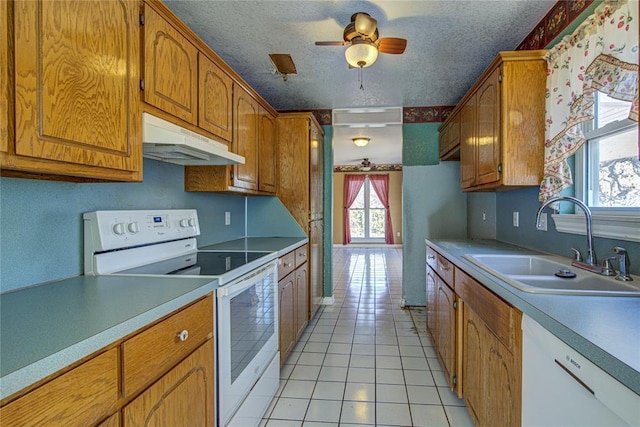 kitchen featuring white appliances, a textured ceiling, ceiling fan, sink, and light tile patterned floors