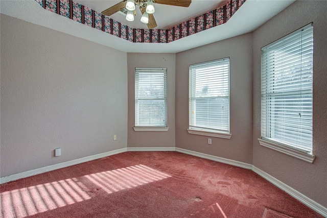 spare room featuring carpet flooring and ceiling fan