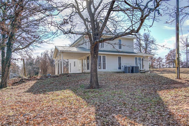 rear view of house with central AC