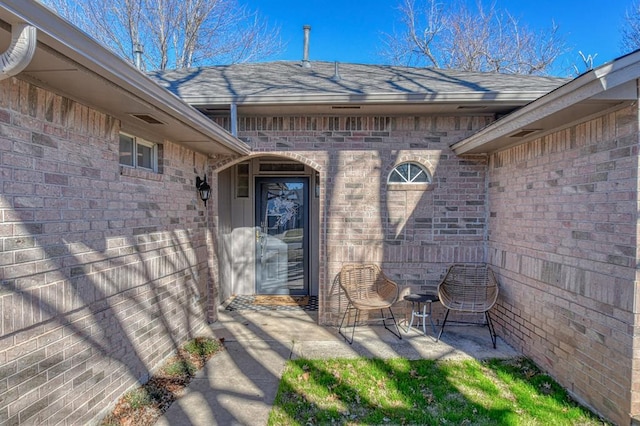 property entrance featuring a patio area