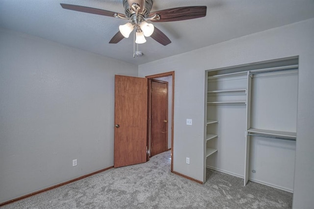 unfurnished bedroom featuring ceiling fan and light colored carpet