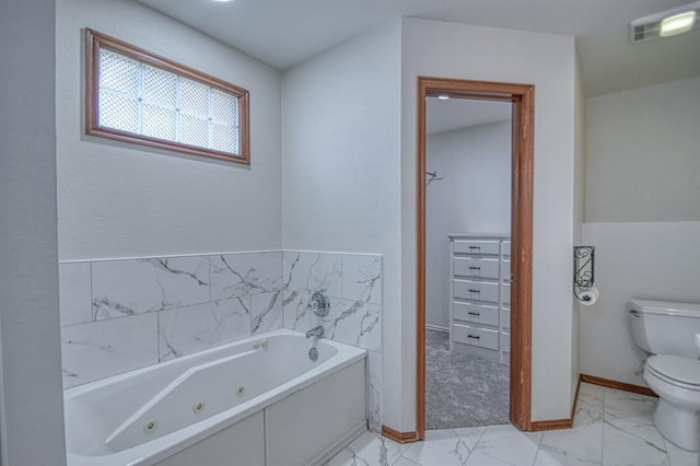 bathroom featuring toilet and a bathtub