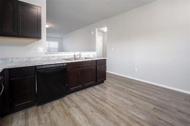 kitchen with dishwasher, light wood-type flooring, dark brown cabinetry, and sink