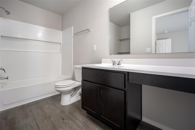 full bathroom featuring hardwood / wood-style floors, vanity, toilet, and shower / bath combination