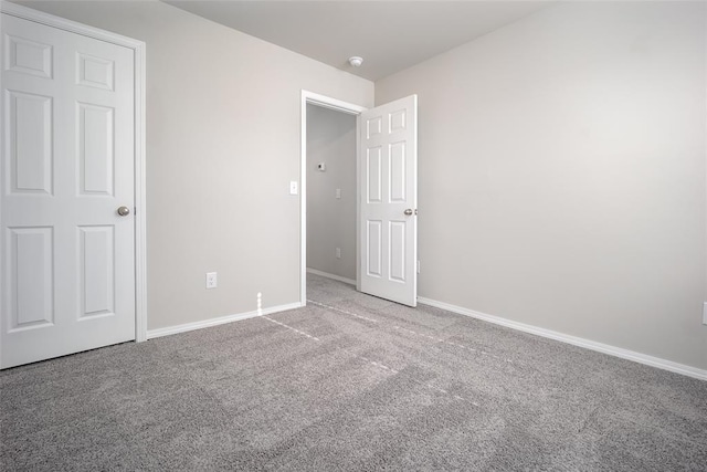 unfurnished bedroom with carpet flooring