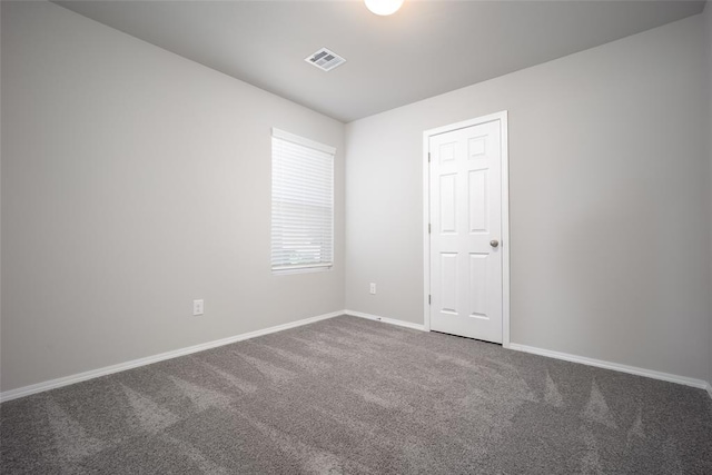 spare room with carpet floors