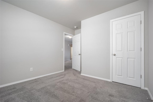 unfurnished bedroom with carpet floors