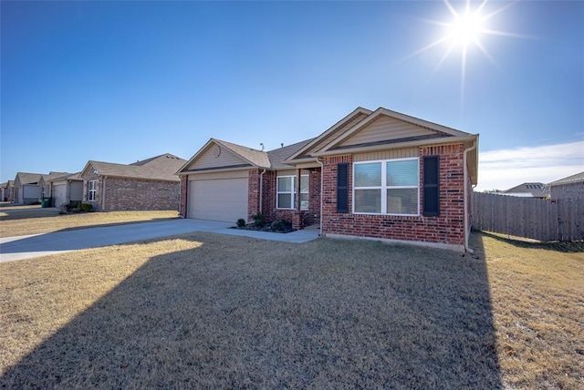 single story home featuring a front lawn and a garage