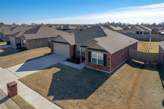 view of front of house featuring a front yard and a garage