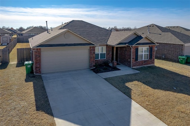 single story home with a front yard and a garage