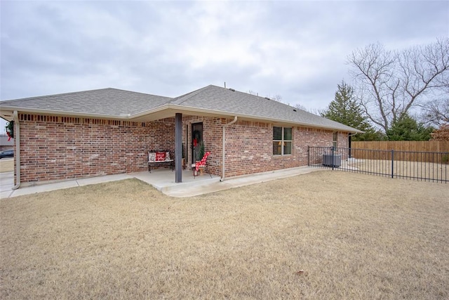 back of property featuring a patio and central AC