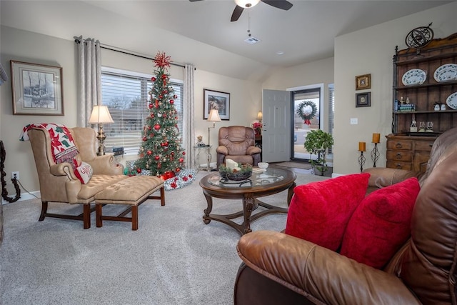 carpeted living room featuring ceiling fan and lofted ceiling