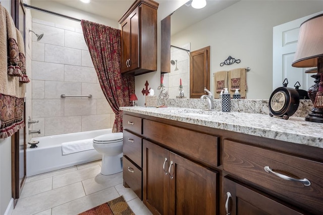 full bathroom featuring tile patterned floors, vanity, toilet, and shower / tub combo with curtain