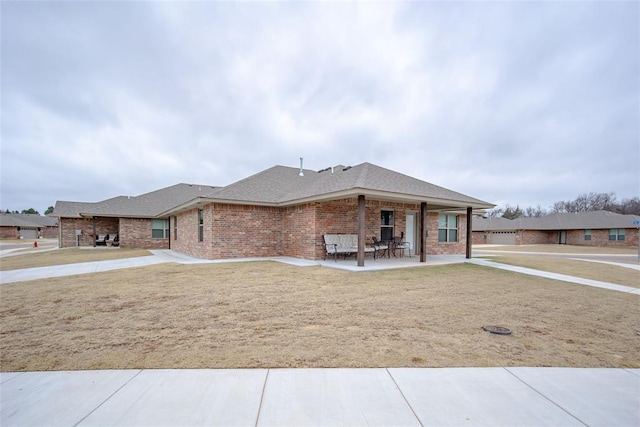 ranch-style home featuring a patio