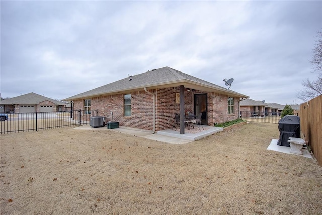 back of property with a patio area and central AC unit