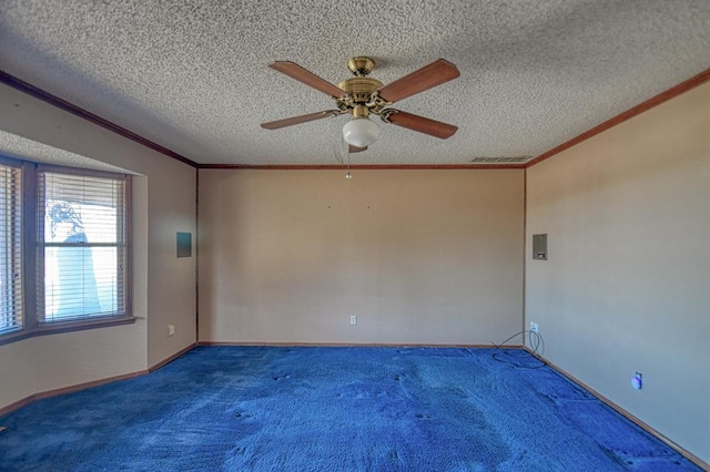 empty room featuring carpet flooring, ceiling fan, crown molding, and a textured ceiling