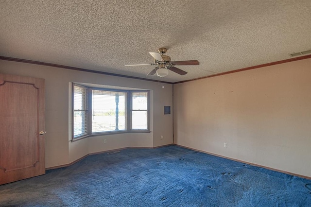 unfurnished room featuring dark colored carpet, a textured ceiling, ceiling fan, and ornamental molding