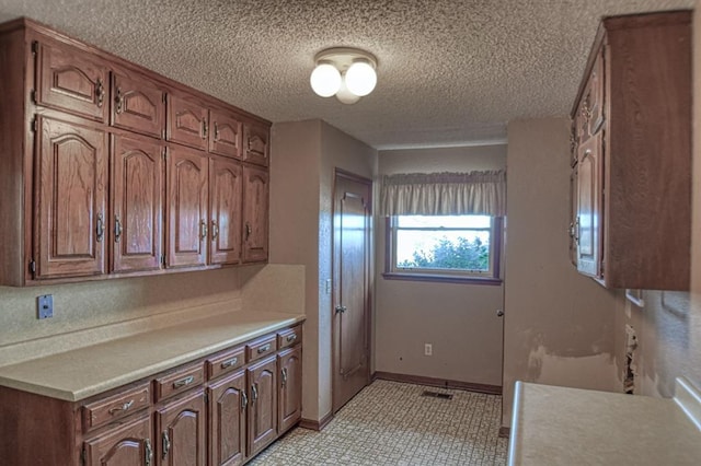 kitchen with a textured ceiling