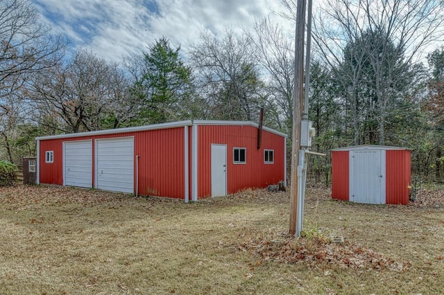 view of outbuilding featuring a yard