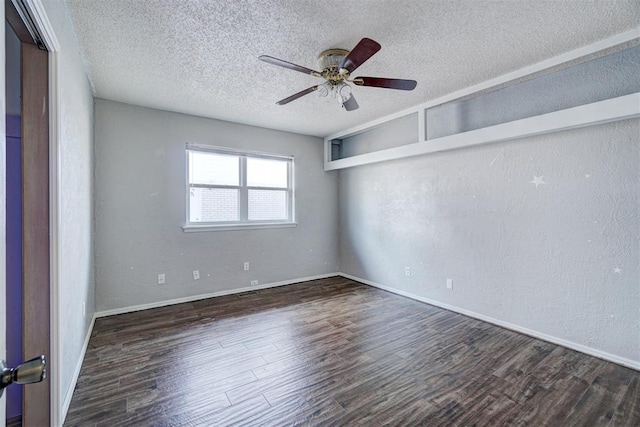 unfurnished room with a textured ceiling, ceiling fan, and dark wood-type flooring