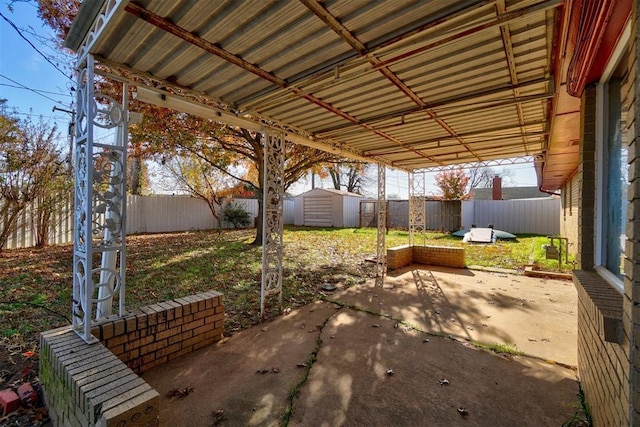 view of patio / terrace featuring a storage unit