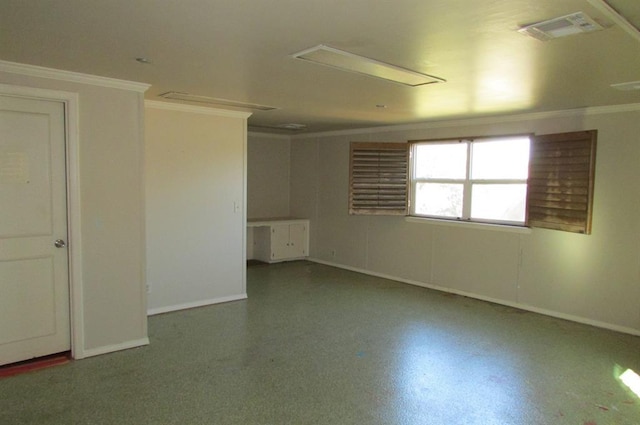 empty room featuring crown molding