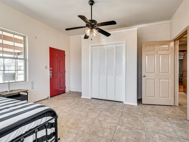 bedroom featuring ceiling fan and light tile patterned flooring