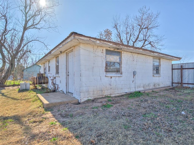 view of property exterior with a yard