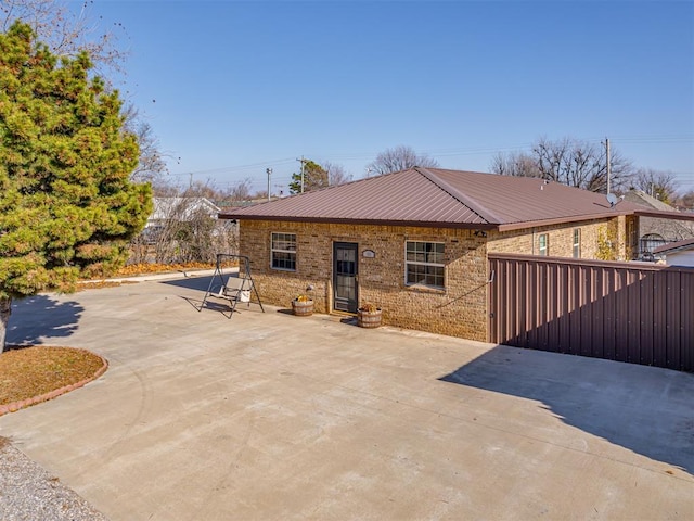 rear view of property featuring a patio